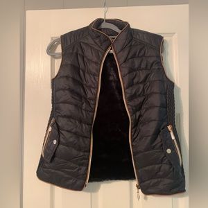 Sleeveless vest size Medium. Never worn. Bought from local boutique.
